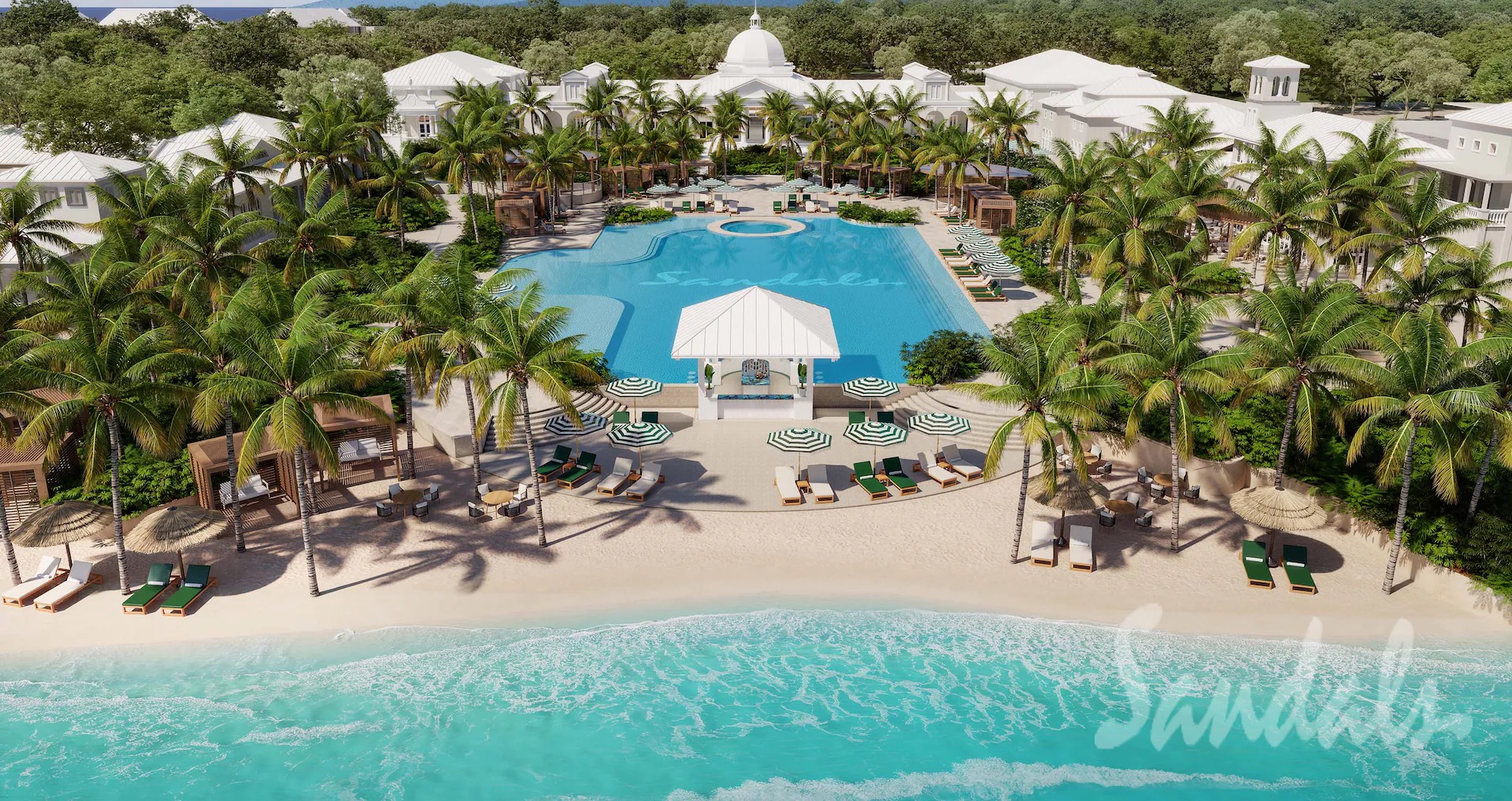 The long waterfront pool lined with palms and loungers at Sandals Jamaica South Coast