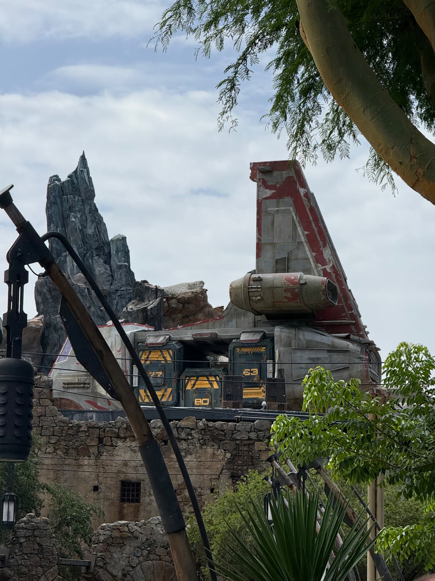 Cargo crates numbered 77, 80 and 83 on top of a docked ship in Star Wars: Galaxy's Edge