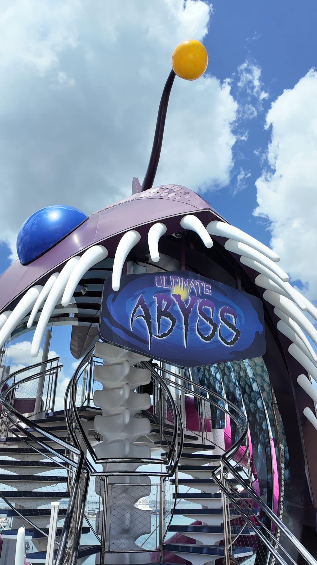 The spiral slide entrance of the Ultimate Abyss beneath its anglerfish sculpture
