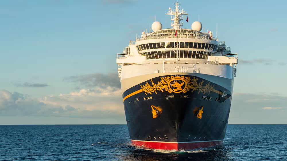 The gold-embellished bow of the Disney Magic at sea