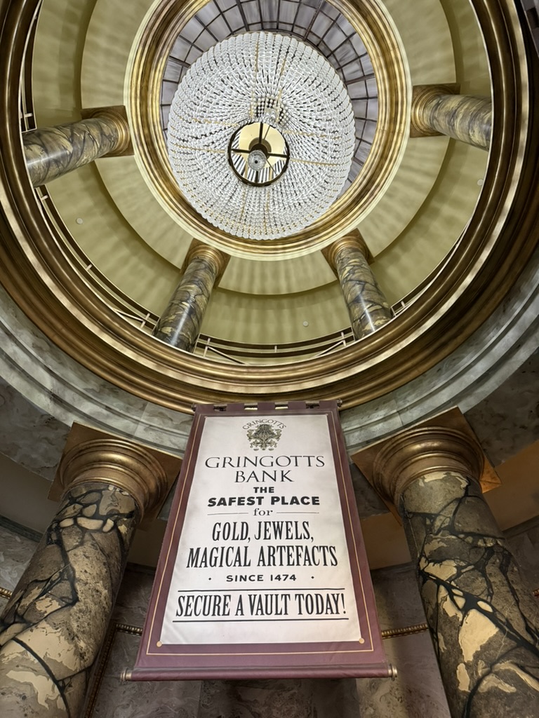 Gringotts Bank banner beneath a grand chandelier at Universal Orlando