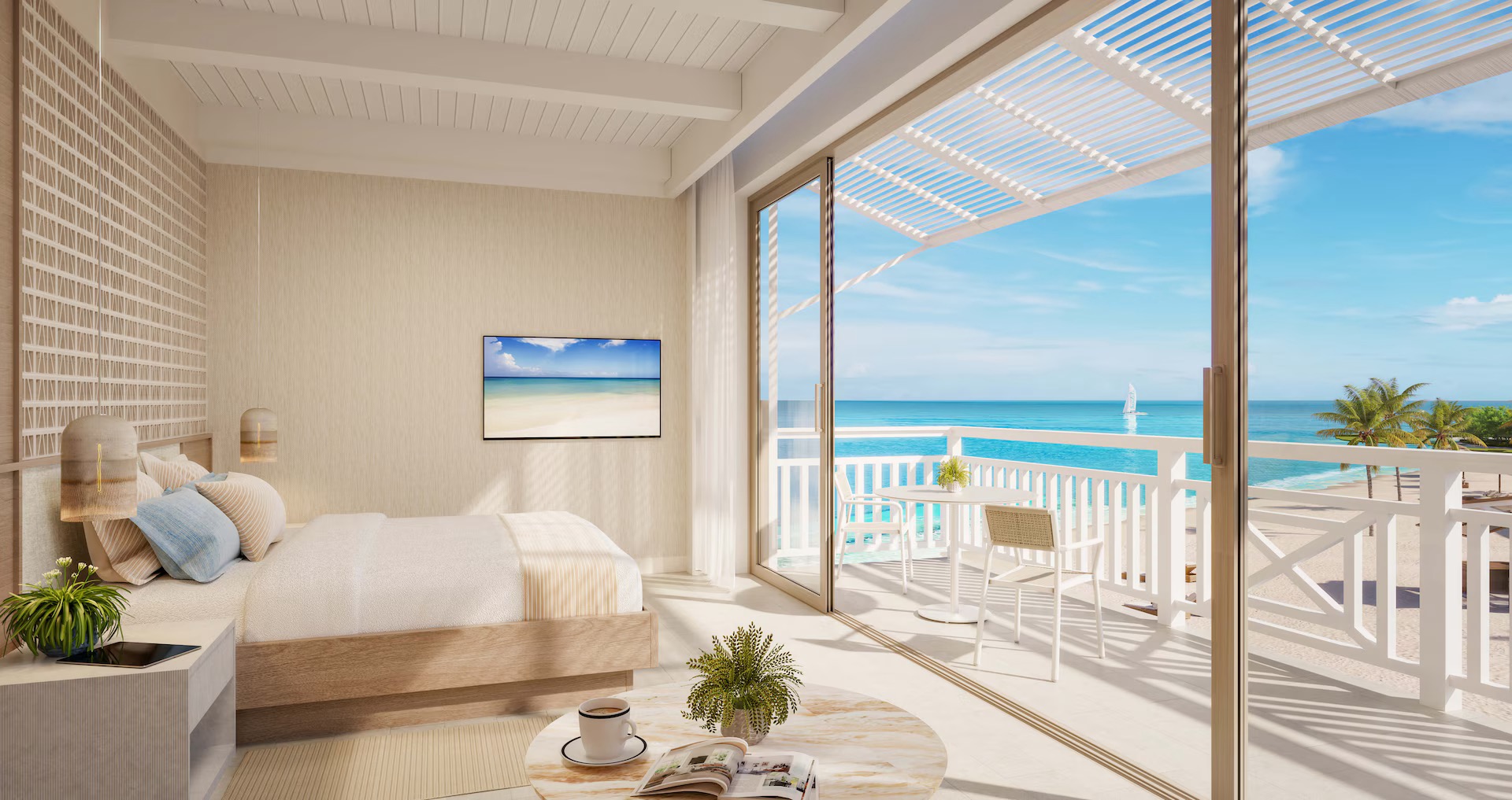 An oceanfront room with a balcony overlooking the sea at Sandals Jamaica Montego Bay