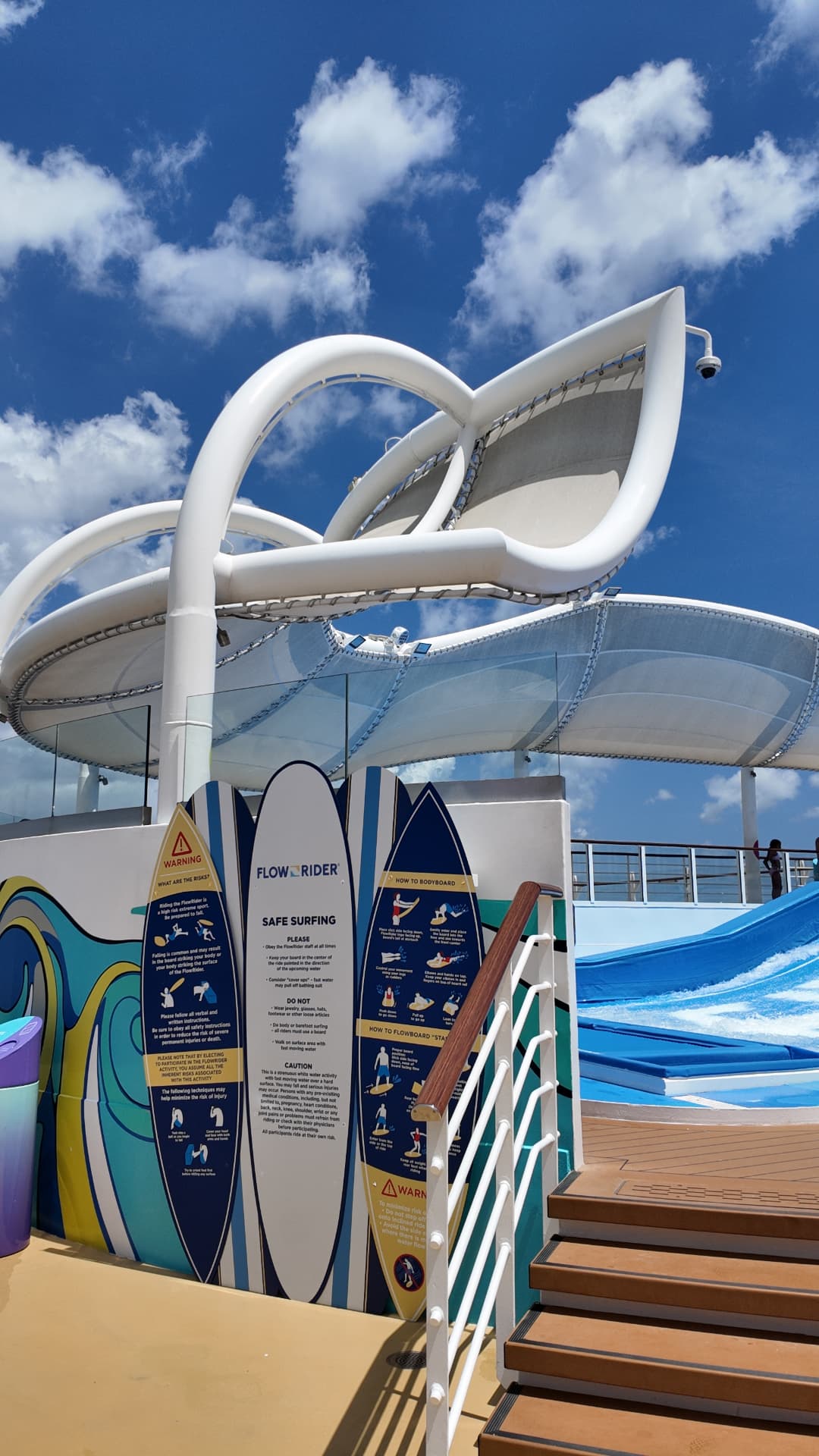 FlowRider safety signs beside the ship's surf simulator