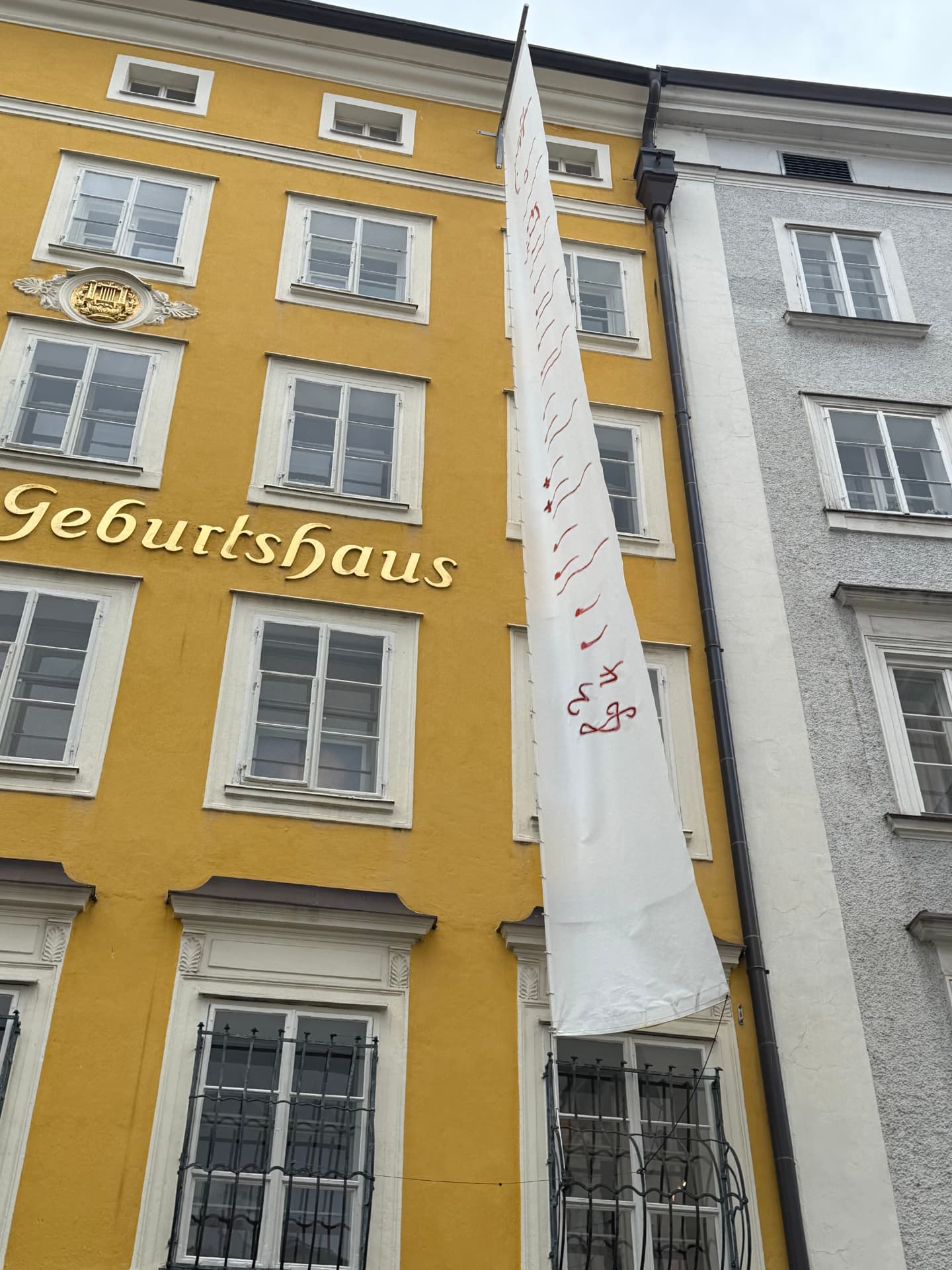 The yellow facade of Mozart's birthplace, Mozarts Geburtshaus, in Salzburg