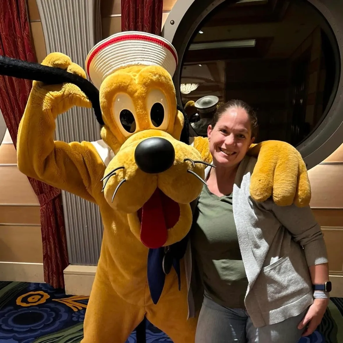 Connie Clopper with Pluto on Disney Cruise Line.