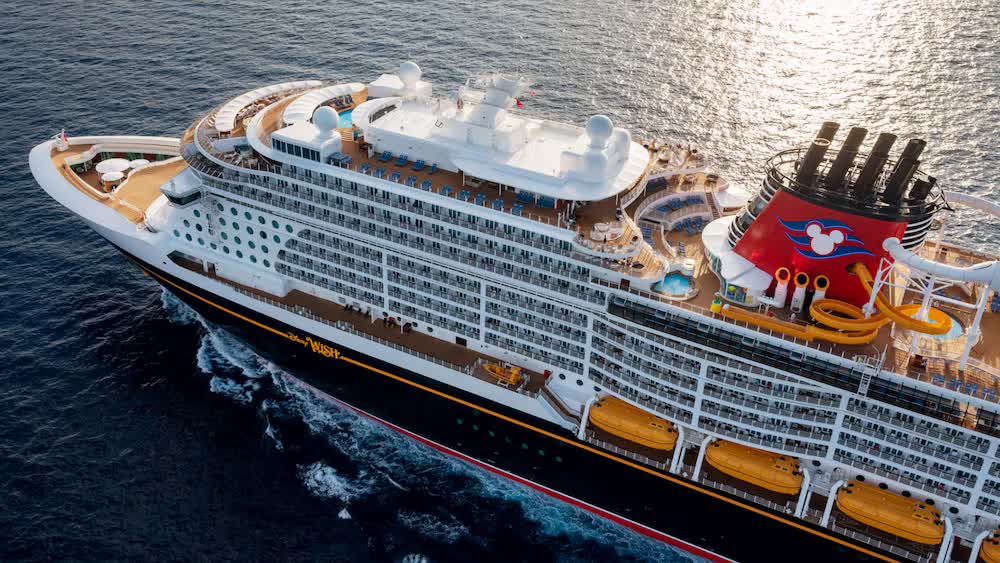 An aerial view of the Disney Wish with her name on the hull