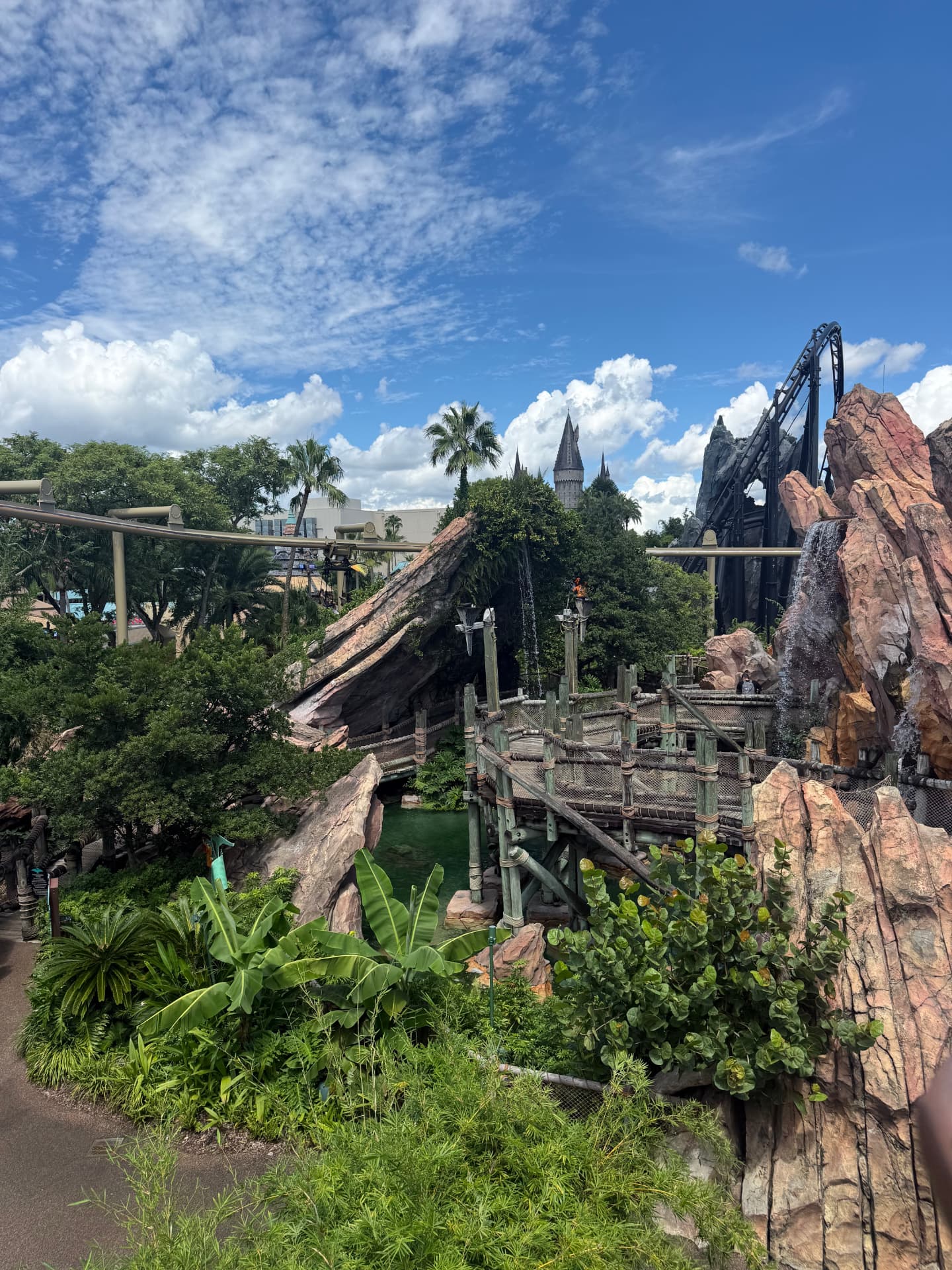 Toon Lagoon with Hogwarts castle and a roller coaster at Universal Islands of Adventure