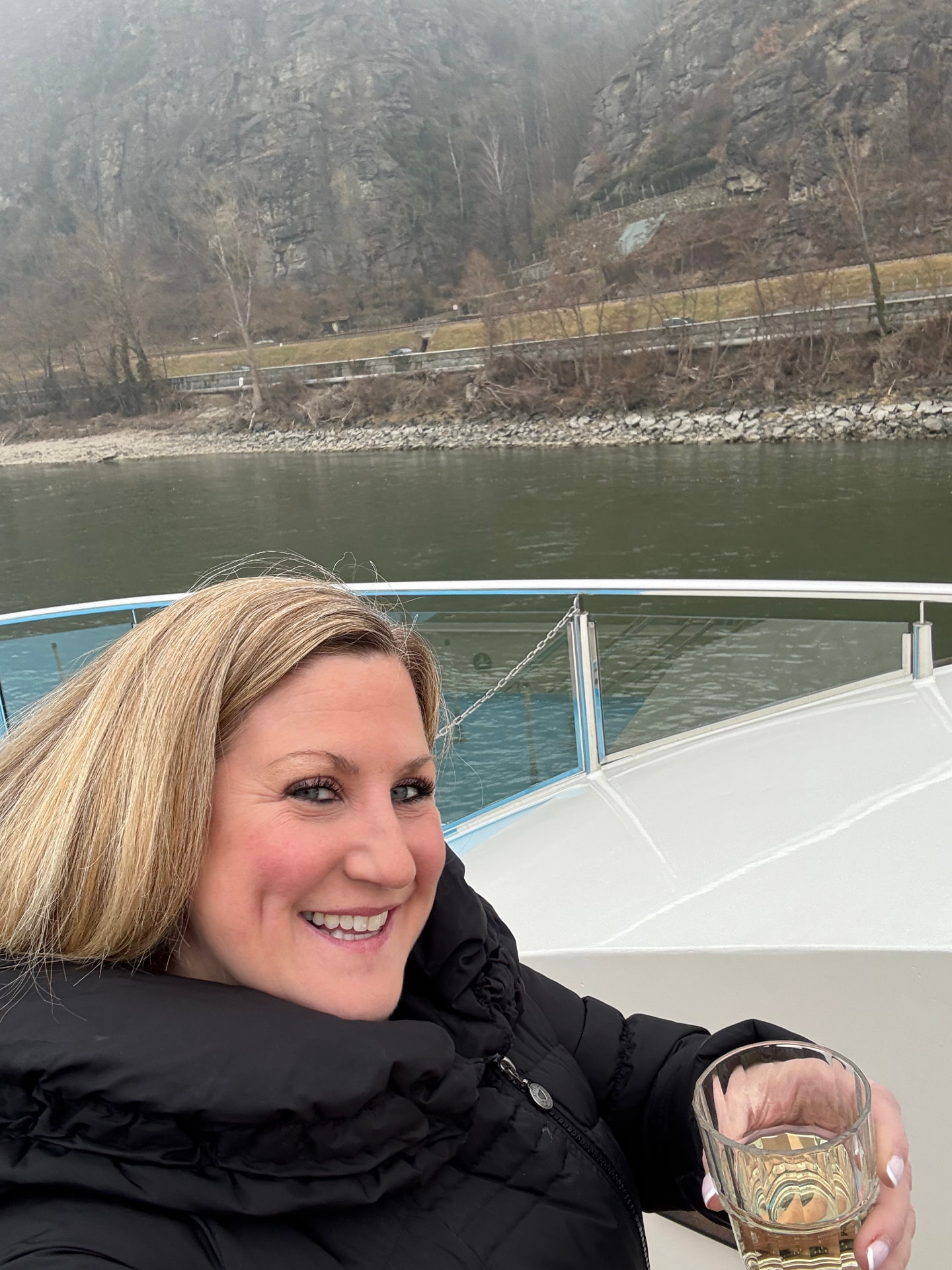 Travel advisor Bridget Edwards of Illumia Travel enjoying a glass of local wine on deck while cruising the Danube